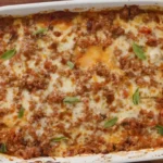Baked zucchini lasagna in a casserole dish with bubbly cheese