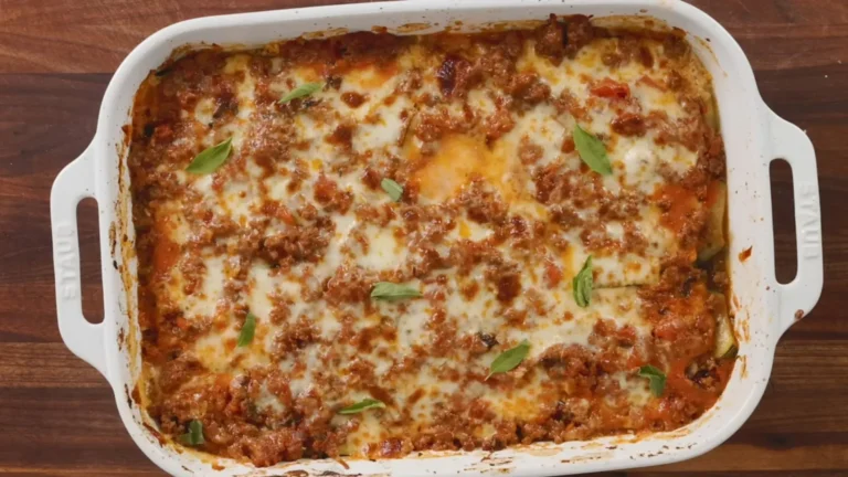 Easy Zucchini Lasagna Recipe 4 Baked zucchini lasagna in a casserole dish with bubbly cheese