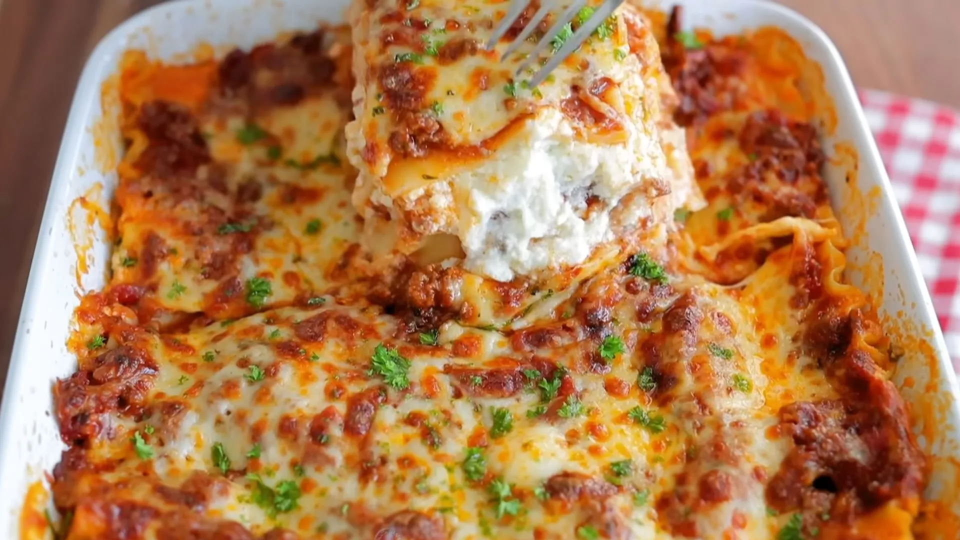Ricotta Cheese Lasagna Recipe 1 Baked lasagna with melted mozzarella and basil garnish