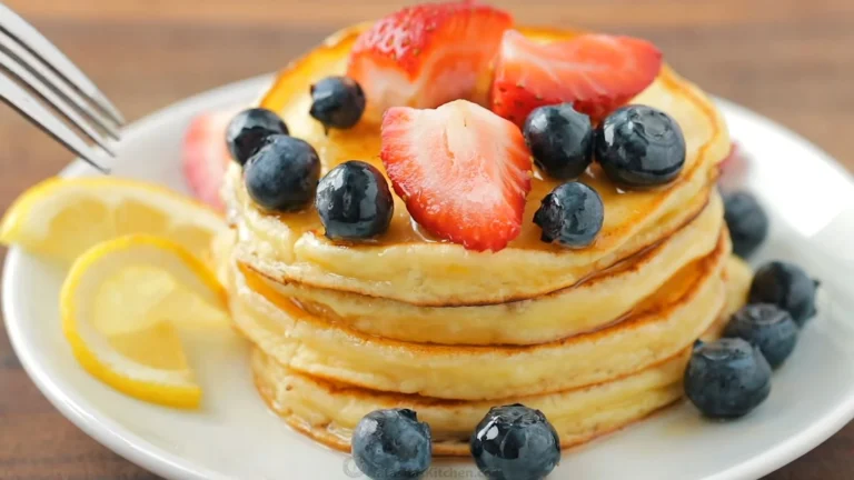 Cherry Ricotta Pancakes (Fluffy, Fruity & Protein Packed Breakfast) 9 Stack of fluffy cherry ricotta pancakes with maple syrup