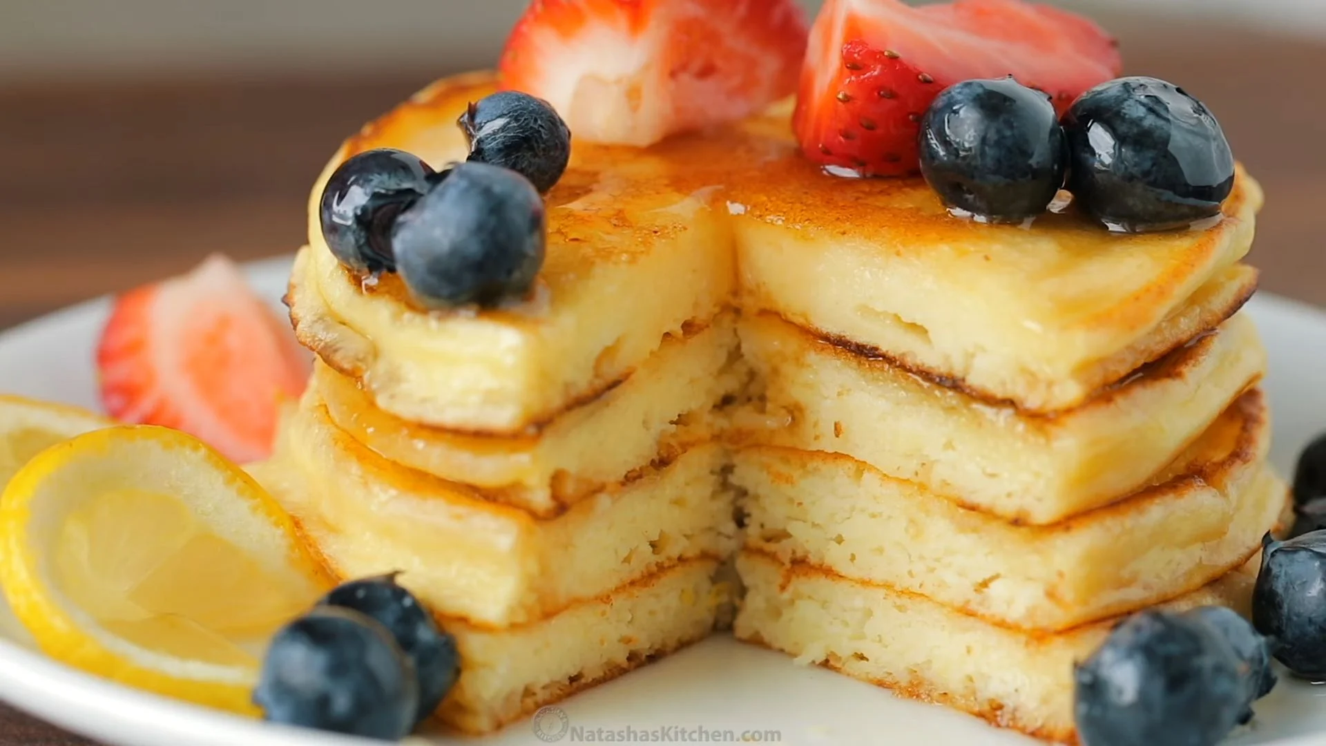 Cherry Ricotta Pancakes (Fluffy, Fruity & Protein Packed Breakfast) 4 Cherry ricotta pancakes topped with cream and fresh cherries
