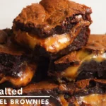 Stacked salted caramel brownies with sea salt and caramel drizzle