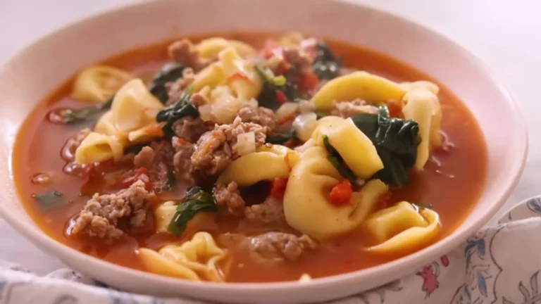 Cozy Sausage Tortellini Soup Recipe 7 Creamy sausage tortellini soup with spinach in a white ceramic bowl