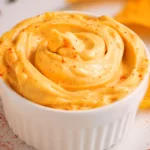 Creamy homemade spicy mayo with sriracha and garlic in a small bowl