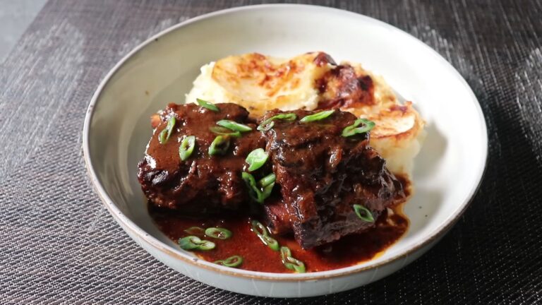 Apple Cider Braised Short Ribs Recipe 6 Tender apple cider braised short ribs served over creamy mashed potatoes with rich sauce.
