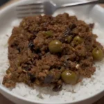 Picadillo served over rice with plantains