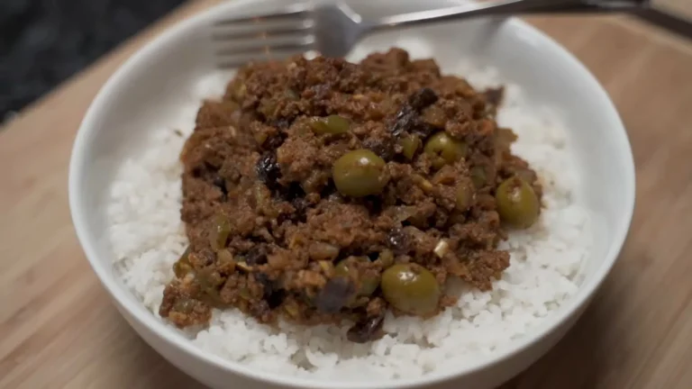 Easy Picadillo Recipe 6 Picadillo served over rice with plantains