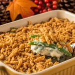 Homemade green bean casserole with crispy fried onions in a baking dish