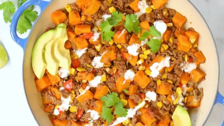 Ground Beef and Sweet Potato Skillet Recipe 5 Ground beef and sweet potato skillet with fresh herbs served in a cast iron pan.