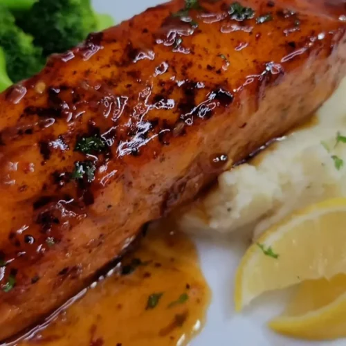 Maple Bourbon Glazed Salmon Recipe 4 Maple bourbon glazed salmon fillet served with vegetables.