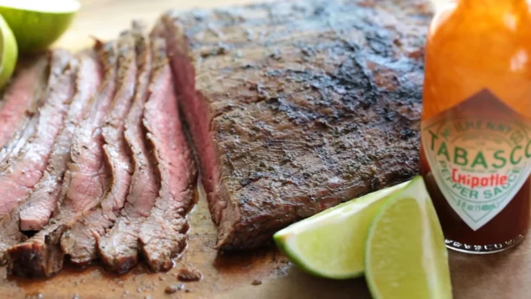 Beef Steak Flank Recipe–Juicy and Easy to Make 7 Raw flank steak with spices and marinade ingredients on a cutting board