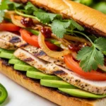 Juicy chicken torta sandwich on a toasted telera