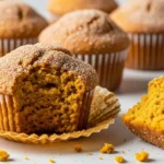 Freshly baked cinnamon sugar pumpkin muffins topped with a sugar coating