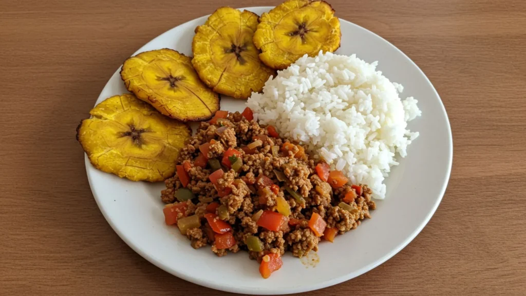 Easy Picadillo Recipe 3 Easy Picadillo served in a white bowl with rice, olives, and parsley garnish