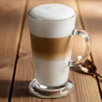 Layered latte macchiato with creamy milk foam.