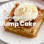 Slice of pumpkin dump cake with whipped cream topping