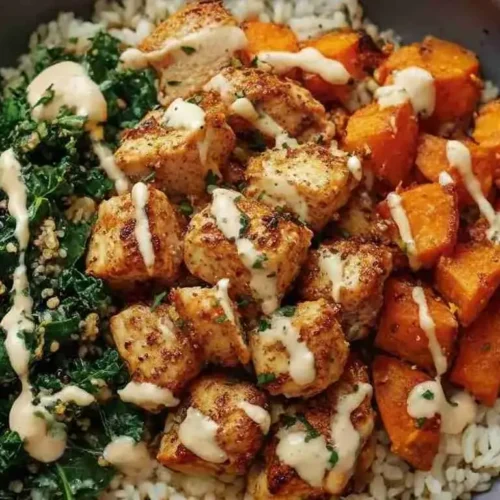 Healthy Chicken & Sweet Potato Rice Bowl 3 Healthy chicken and sweet potato rice bowl served with creamy dressing.