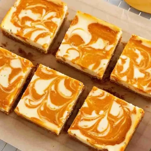 Easy Pumpkin Spice Cheesecake Bars Recipe 5 Pumpkin Spice Cheesecake Bars with graham crust and swirled top