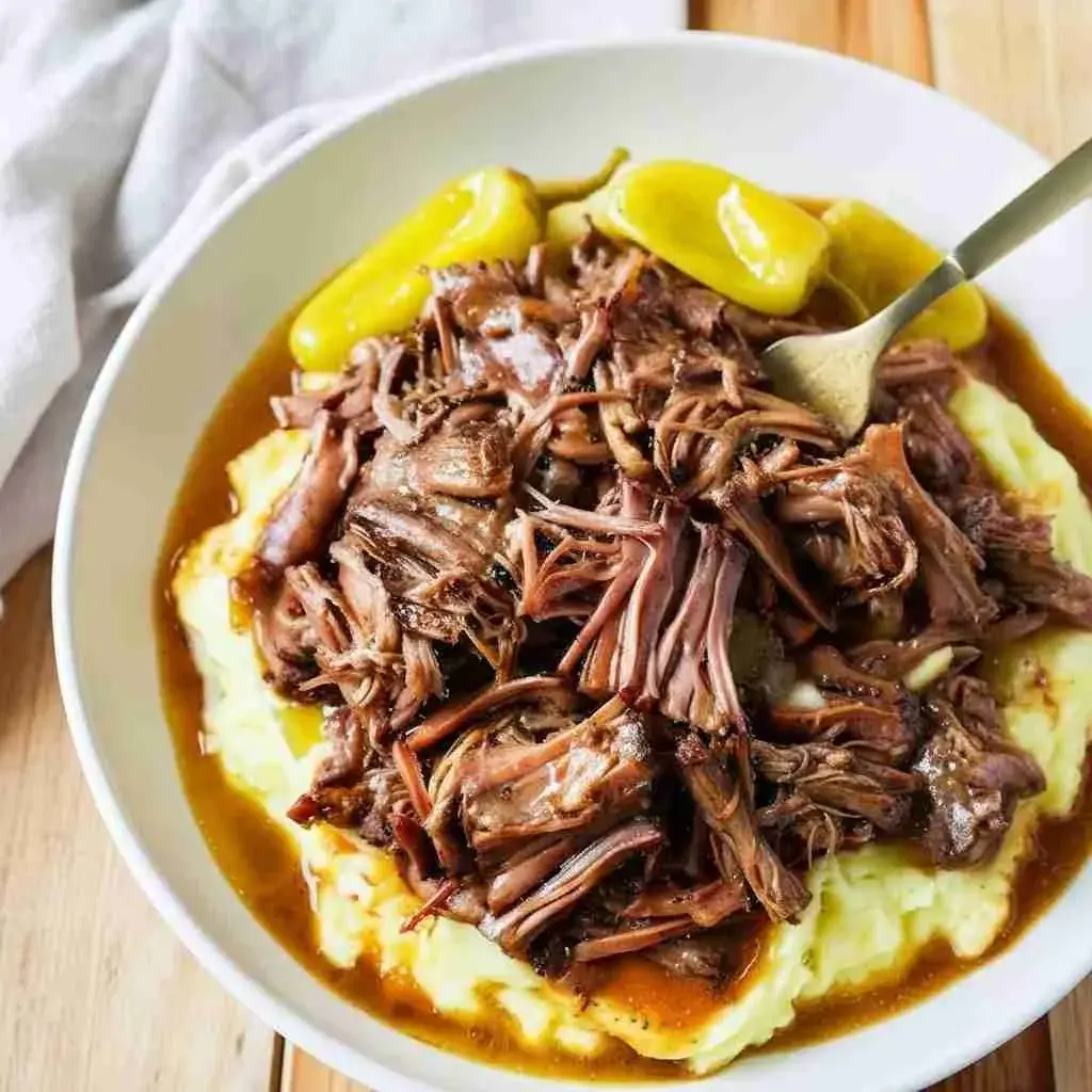 Crockpot Mississippi Pot Roast 2 Crockpot Mississippi pot roast served over mashed potatoes with gravy