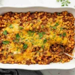 Baked ground beef and potatoes casserole with melted cheese