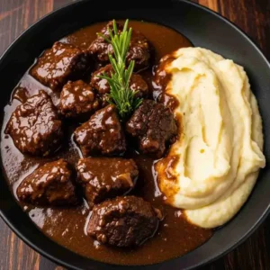 Slow Cooker Beef Manhattan served with mashed potatoes and gravy