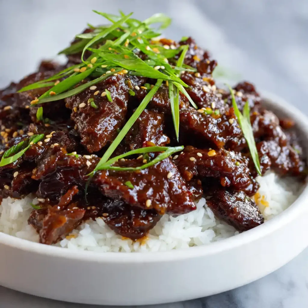 Slow Cooker Mongolian Beef 4 Slow Cooker Mongolian Beef served with rice and steamed broccoli