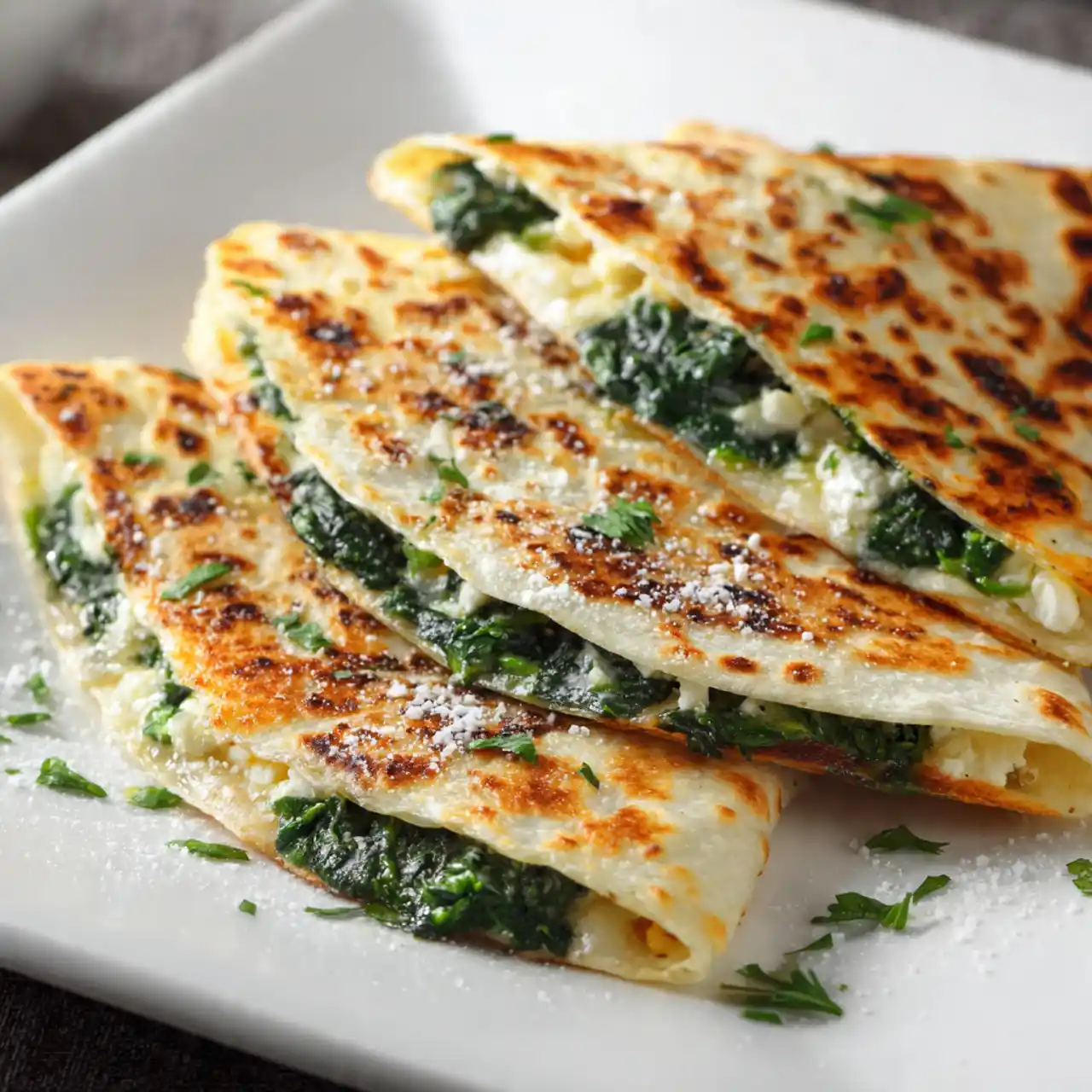 Spinach and Feta Quesadillas sliced and served on a plate