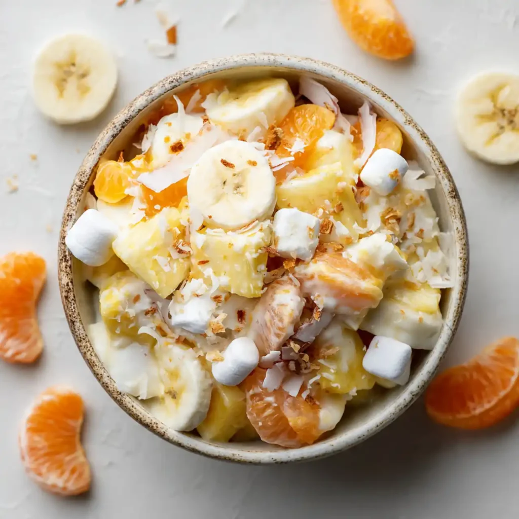 ingredients for easy hawaiian fruit salad recipe including pineapple mandarin oranges coconut and cherries